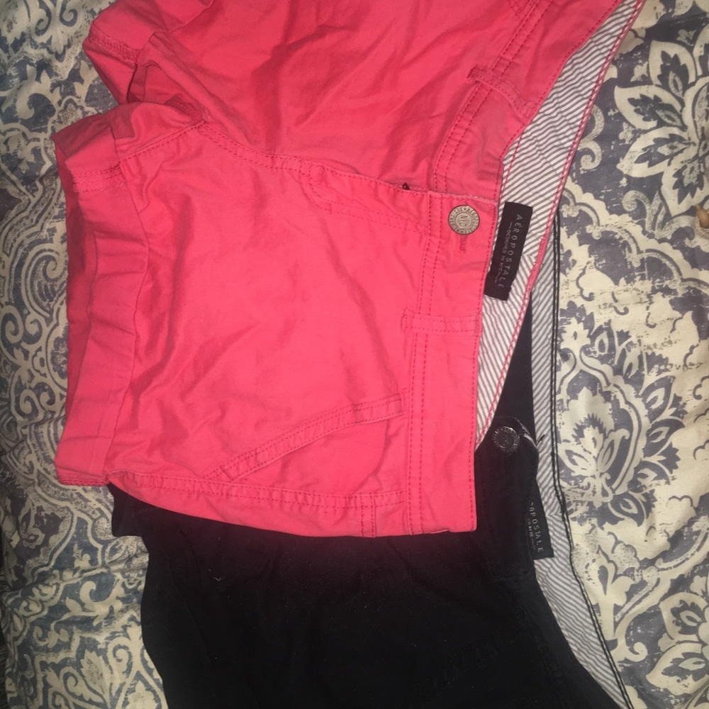 2 pair of black and pink Aero shorts.